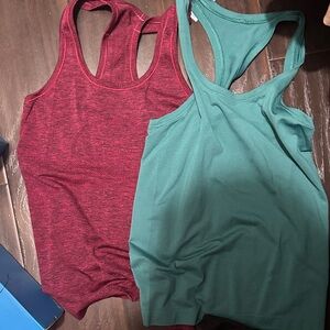 Bundle of 2 lululemon swiftly tech tanks size 6 both.